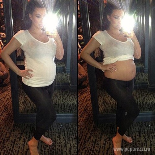 Ким Кардашиан показала беременный живот на страницах US Weekly